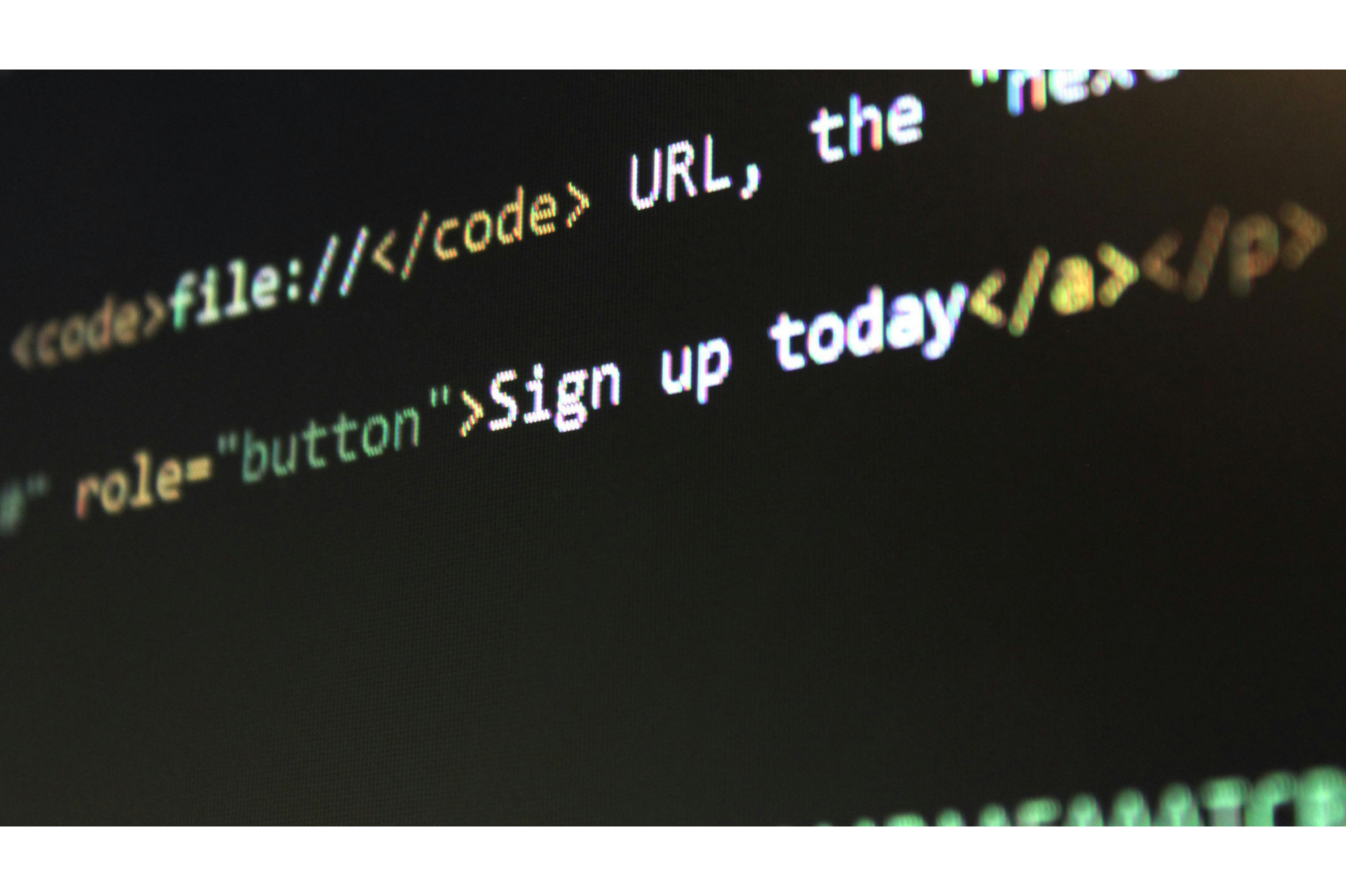 Close-up of website code on a dark screen with the words “Sign up today” highlighted in white text.