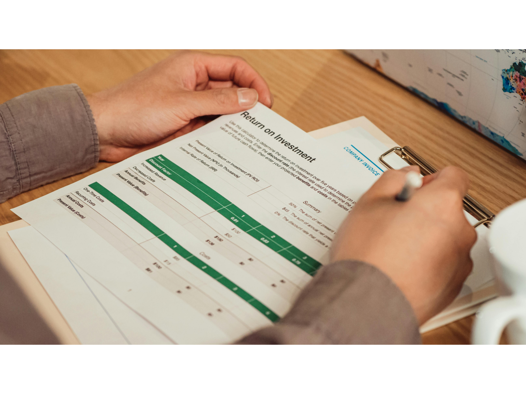 A person reviewing a 1040 tax form at a desk, illustrating the contractor paperwork that slows creator program onboarding.
